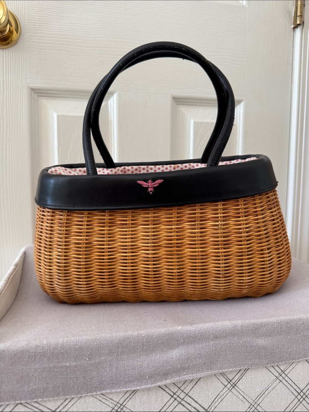 Woven Basket-Style Handbag with Black Trim and Pink Accent